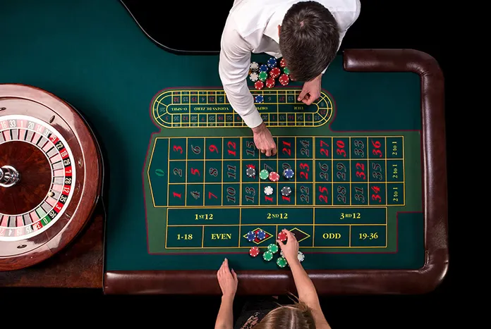 Happy Bangladeshi user pointing to a bright digital gate with betting icons — showing easy profile help.